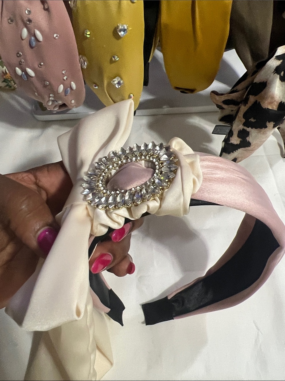 Elegant Pink Satin Headband with Crystal Brooch Accent